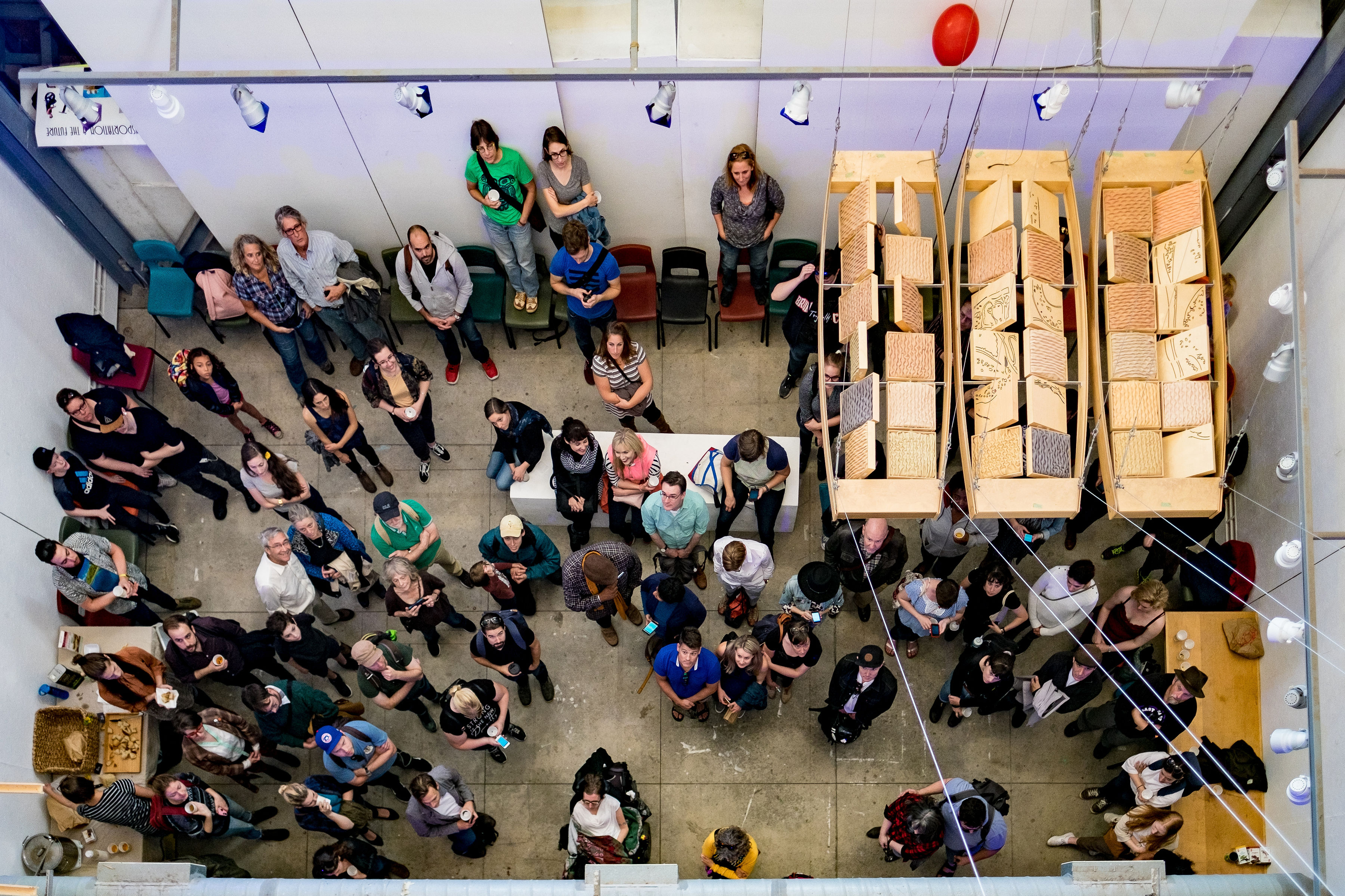 An aerial shot of members of the This is Nowhere audience gathered at the end of the performance.