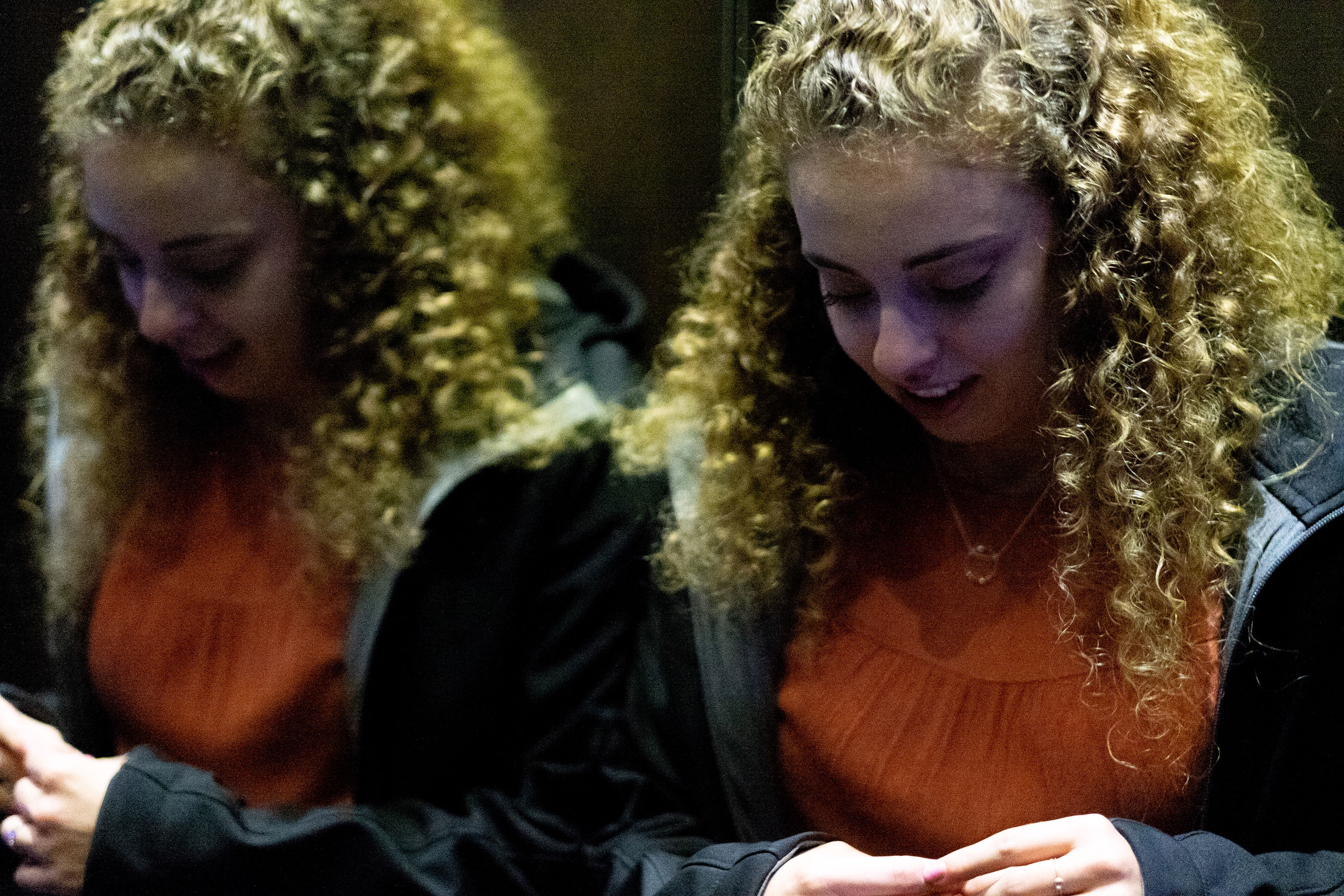 Woman in elevator.